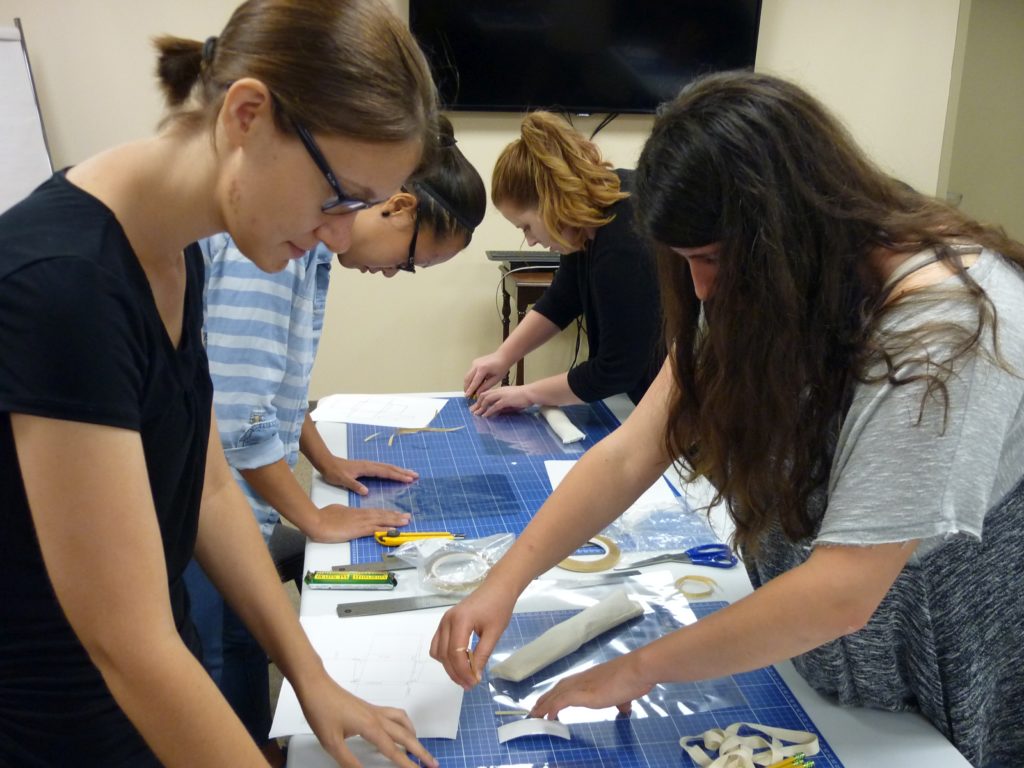 Students making mylar enclosures