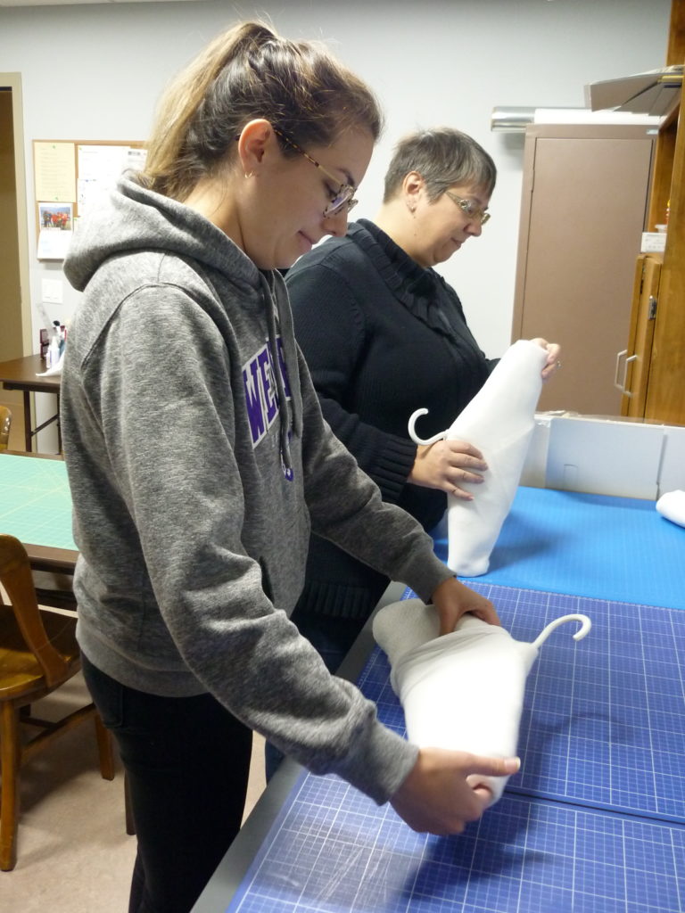 Students making padded hangers